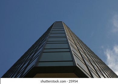 a triangular buidling looking upward.