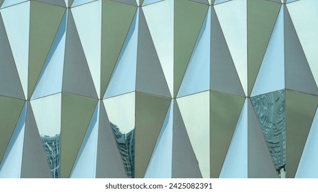 Triangular building facade made of green glass, glass facade of modern building, Modern office building glass An architectural detail in green tones. Abstraction. - Powered by Shutterstock - Get 15% off with code: PIKWIZARD15