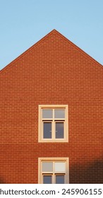 Triangular Building With Windows Orange and Blue