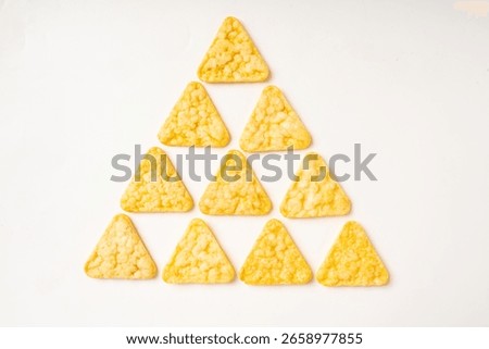 Triangular cheese corn potato chips