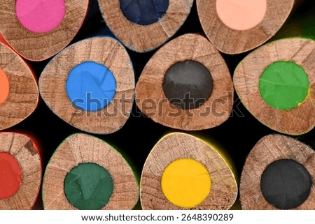 Triangular Colored Pencils - Macro End View. tightly packed composition creates an abstract pattern, highlighting the textural detail