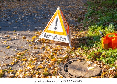 triangular german warning sign baumarbeiten, tree work ahead exclamation mark, public safety, winter maintenance urban or park trees, professional tree pruning, before new growth begins, trees trimmed