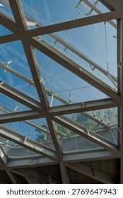 Triangular Glass Skylight Supported by Modern Steel Framework - Contemporary Architectural Roofing System. Perfect for architects, engineering studios, and innovative building design portfolios.