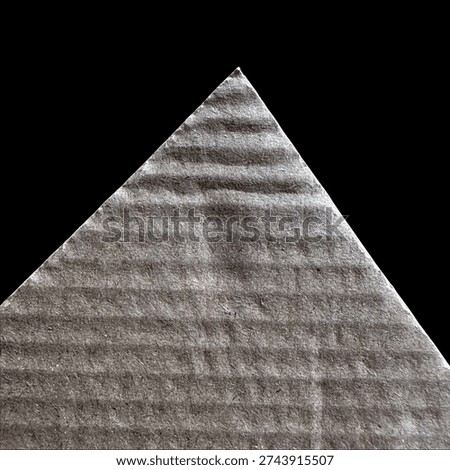 Triangular gray textured fabric on black background