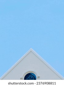 triangular house with blue sky