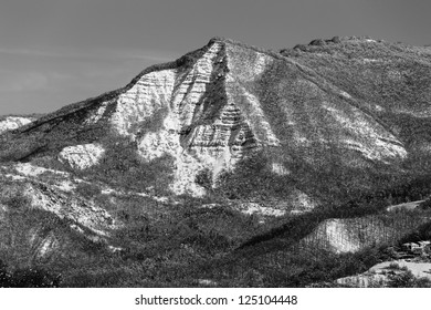 Triangular mountain covered by snow