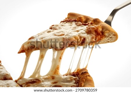 a triangular pizza slice being lifted with a stainless steel spatula