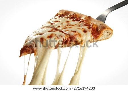 a triangular pizza slice being lifted with a stainless steel spatula
