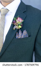 Triangular Pocket Square On Green Jacket With Pink Rose Boutonniere