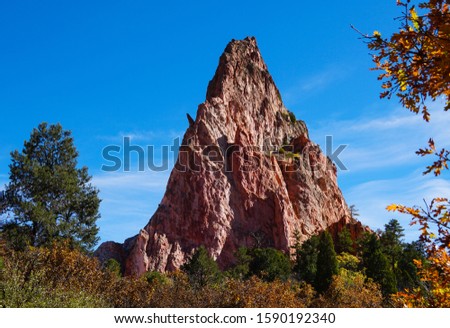 A triangular shaped sandstone formation marks one of the sides of Perkins Central Garden in Garden of the Gods.