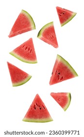 Triangular slices of ripe watermelon floating on a white background.