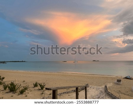 Triangular sunset over the beach with beautiful clouds 