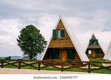 Triangular wooden two-story houses in Durmitor National Park - Shutterstock ID 2260492777
