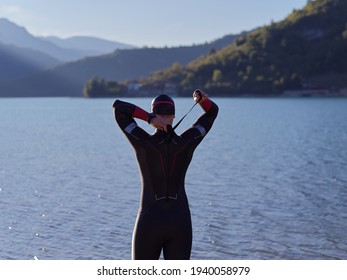 Triathlete Swimmer Portrait Wearing Wetsuit On Training