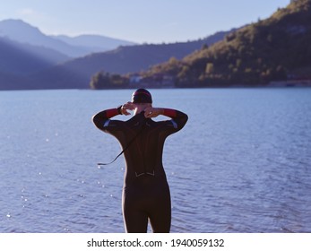 Triathlete Swimmer Portrait Wearing Wetsuit On Training