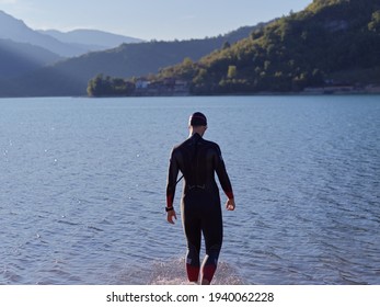 Triathlete Swimmer Portrait Wearing Wetsuit On Training