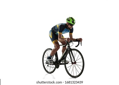 Triathlon Male Athlete Cycle Training Isolated On White Studio Background. Caucasian Fit Triathlete Practicing In Cycling Wearing Sports Equipment. Concept Of Healthy Lifestyle, Sport, Action, Motion.