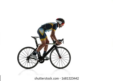Triathlon Male Athlete Cycle Training Isolated On White Studio Background. Caucasian Fit Triathlete Practicing In Cycling Wearing Sports Equipment. Concept Of Healthy Lifestyle, Sport, Action, Motion.