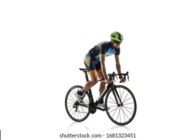 Triathlon Male Athlete Cycle Training Isolated On White Studio Background. Caucasian Fit Triathlete Practicing In Cycling Wearing Sports Equipment. Concept Of Healthy Lifestyle, Sport, Action, Motion.