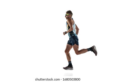 Triathlon male athlete running isolated on white studio background. Caucasian fit jogger, triathlete training wearing sports equipment. Concept of healthy lifestyle, sport, action, motion. Side view. - Shutterstock ID 1680503800