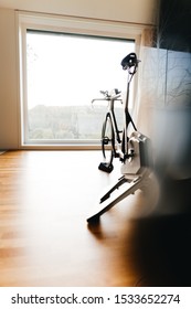 Triathlon Super Bike On A Turbo Trainer In A Modern Flat With Big Window