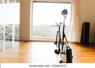 Triathlon Super Bike On A Turbo Trainer In A Modern Flat With Big Window