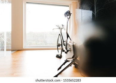 Triathlon Super Bike On A Turbo Trainer In A Modern Flat With Big Window