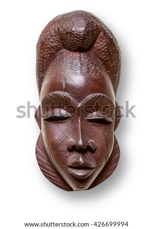 A tribal mask from  Africa, silhouetted on white with clipping path.