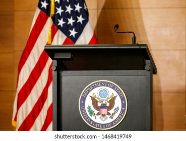 A Tribune For Official Statement With Sign Of Department Of State United States Of America , A Microphone And A The US Flag During An Event In Kiev, Ukraine, 27 July 2019