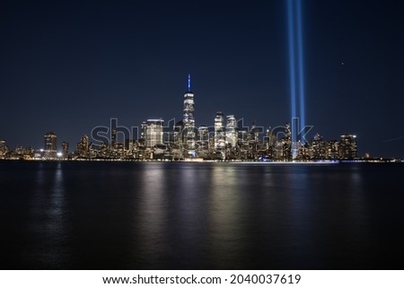 The Tribute in Light installation and One World Trade Center are seen over lower Manhattan on the 20th anniversary of the September 11 attacks, from Jersey City 9-11 Memorial site, September 11, 2021.