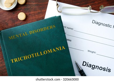  Trichotillomania Concept. Diagnostic Form And Book On A Table.