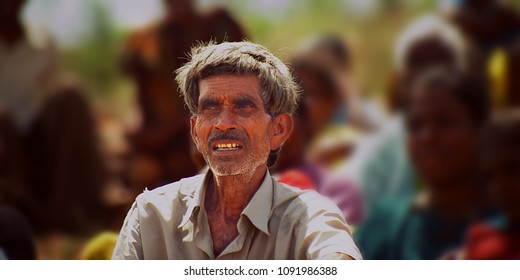 TRICHY, INDIA - JULY 15TH, 2017: Farmer Sitting In The Field, 