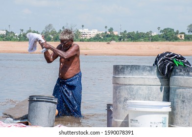 Trichy,Tamil Nadu,India-december12,2019:An Old Man Doing Laundry Work In The River Kollidam.