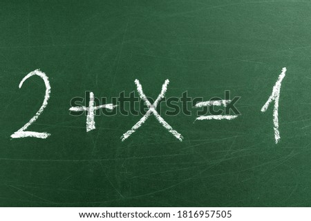 Tricky math equation on the green School blackboard. Handwriting simple mathematical equations. Education and learning