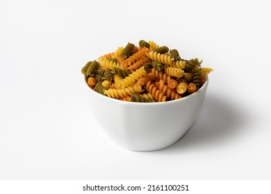 Tricolor Fusilli Pasta In A White Bowl On White Background