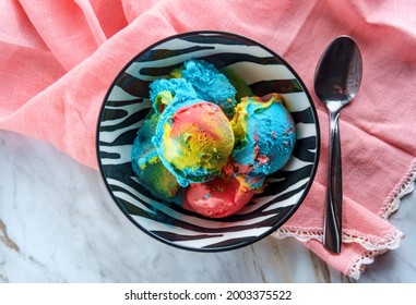 Tricolor Superman Icecream In Zebra Stripe Bowl Featuring Blue Moon Vanilla And Black Cherry Flavors