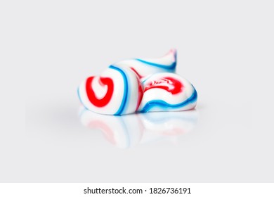 Tricolor Toothpaste Sample Isolated On Light Background. Tooth Care Cream Smudge Close-up. Dental Hygiene Product