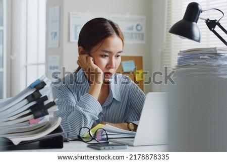 Tried Asian office employee feeling bored, unhappy and burnout working in office