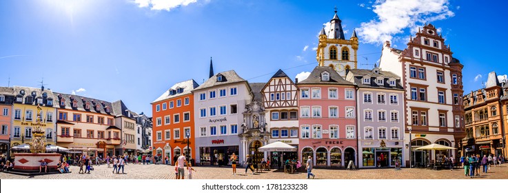 Trier, Germany - July 7: historic buildings and tourists at the famous old town of Trier in Germany on July 7, 2020
