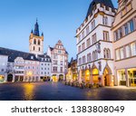 TRIER, GERMANY - MARCH 28, 2017: historic city center of Trier with famous Hauptmarkt market square and St. Gangolf church in beautiful post sunset twilight at dusk in summer, Rheinland-Pfalz, Germany