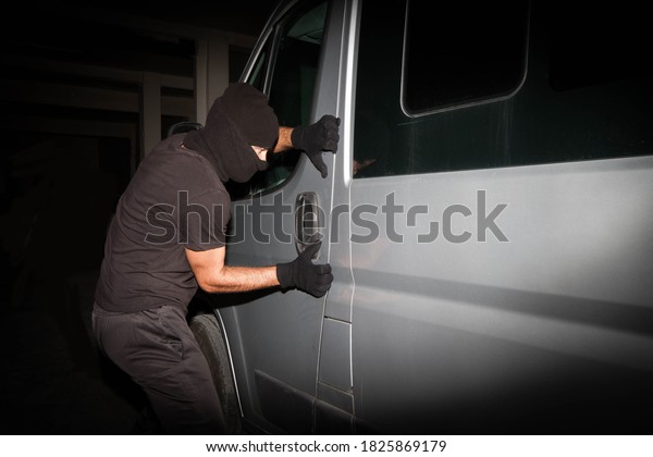 \
Tries to\
open a door.A hooded robber man tries to steal a vehicle. A hooded\
robber man tries to steal a\
vehicle