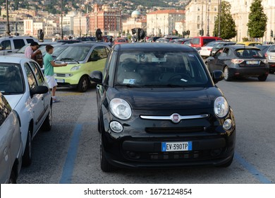 Trieste, ITALY - JUNE 19, 2014:  FIAT 500L pre-facelift modern Italian mini MPV (compact minivan) vehicle car on the parking. 