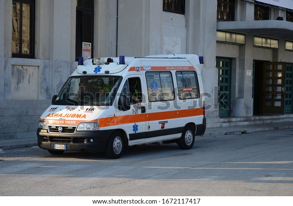 Trieste, ITALY - JUNE 19,\
2014: Ambulance emergency van FIAT Ducato on duty in the empty\
centre city street