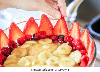 Trifle Being Prepared In A Glass Bowl