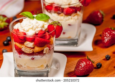 Trifle Or Cheesecake With Strawberry On Wood Table