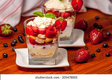 Trifle Or Cheesecake With Strawberry On Wood Table