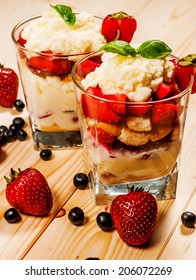 Trifle Or Cheesecake With Strawberry On Wood Table