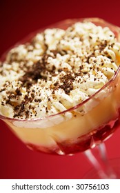 Trifle In Glass Bowl, Made With Raspberries,custard,sponge,whipped Cream And Grated Dark Chocolate