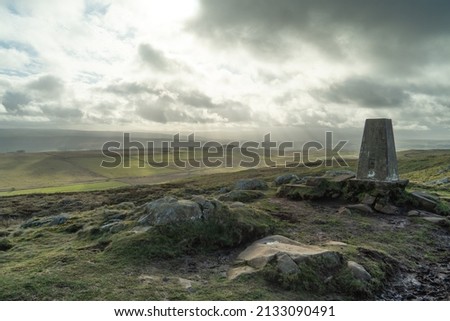 Trig point, near Twice Brewed, on Hadrian's Wall, Northumberland, UK. The area is a UNESCO World Heritage Site.