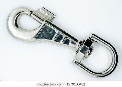 Trigger Clips – these are useful for holding things such as keys to a bag. Metal carabiner for collars made of silumin. Big strong carabiner color nickel isolated on a white background.